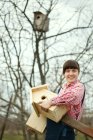 thumbnail_womanwithnewbirdhouses.jpg